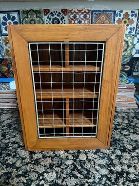 The Body Shop wooden display cabinet with silver grid